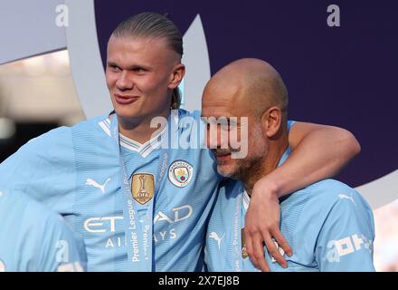 Manchester, UK. 20th May, 2024. Manchester City's manager Pep Guardiola (R) celebrates with Erling Haaland after the English Premier League football match between Manchester City and West Ham United in Manchester, Britain, on May 19, 2024. Credit: Xinhua/Alamy Live News Stock Photo