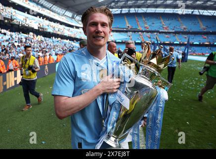 Manchester, UK. 20th May, 2024. Kevin De Bruyne of Manchester City celebrates with the Premier League trophy after the English Premier League football match between Manchester City and West Ham United in Manchester, Britain, on May 19, 2024. Credit: Xinhua/Alamy Live News Stock Photo