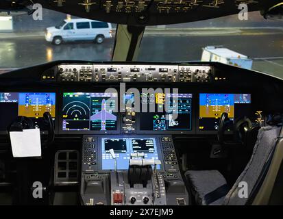 Flight control panel and flight management system in civil airplane cockpit. Stock Photo