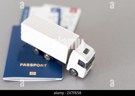 Big White toy truck over Tickets on a white background. 3d Rendering Stock Photo