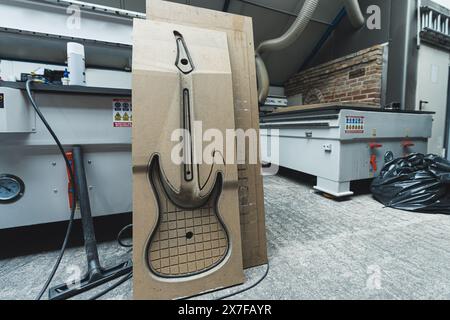 full shot of a guitar MDF board mold using to produce electric guitars, factory. High quality photo Stock Photo