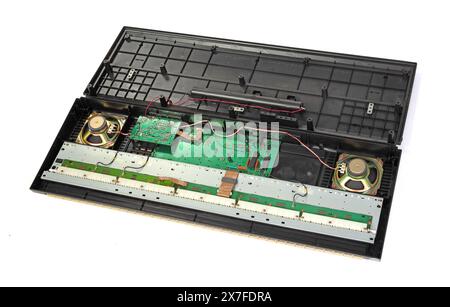 Old synthesizer opened for repairs, isolated on white Stock Photo