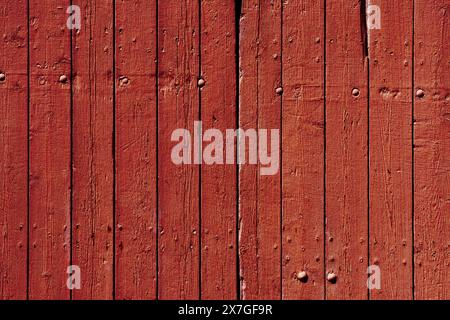 Vertical rustic wood planks with lots of texture in red tones. Stock Photo