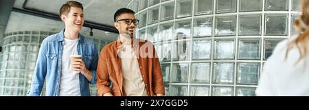 Two colleagues standing proudly in front of a building during a corporate trip, embodying diversity and unity. Stock Photo