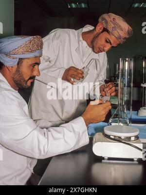 Muscat, Oman, Arabian Peninsula, Middle East - Omani Lab Technicians at Work in Oman's Quality Control Laboratory. Stock Photo