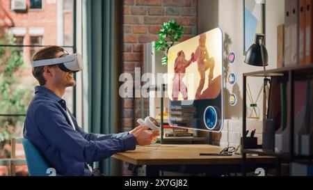 Excited Young Man Sitting in Loft Living Room at Home, Using Virtual Reality Headset with Controllers to Check Social Media Streaming Application. Male is Watching Life in Space Documentary. Stock Photo