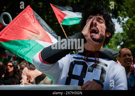 Pamplona, Spain. 18th May, 2024. A protester chants slogans while holding a banner during the demonstration. Thousands of people participated in a demonstration through the streets of Pamplona calling for a free Palestine. Credit: SOPA Images Limited/Alamy Live News Stock Photo