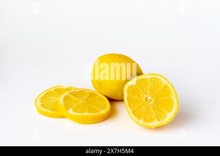 A Lemon and lemon slices on a white background Stock Photo