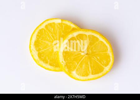 Two lemon slices on a white background Stock Photo