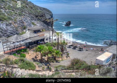 HDR image of the Beach and La Cala restaurant at Cala del Barco in La Manga Golf Resort Murcia Spain Stock Photo