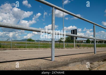 galvanized steel handrail in the pedestrian passage. Railing to prevent falls on the unevenness of a ramp onto a pavement. Stock Photo
