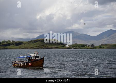 Small Boat named Purple Heather sailing, near Oban, Scotland Stock Photo