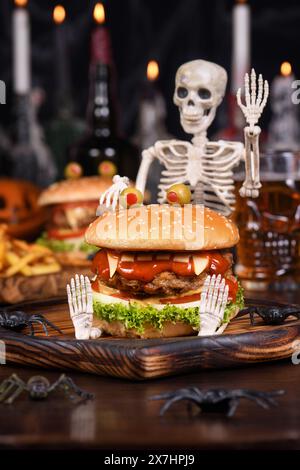 The Monster Burger on a sitting skeleton will definitely lift your spirits and is the perfect Halloween party appetizer. Stock Photo