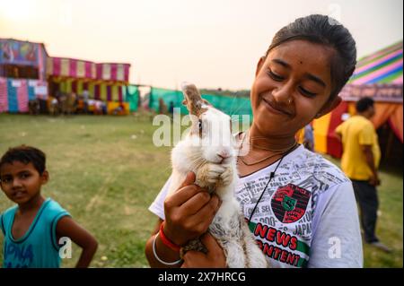 A young village girl and her brother visit the fair with their pet