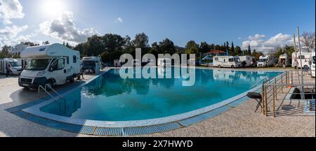 Ouezzane, Morocco - 2 Marhc, 2024: many motor homes and RVs parked around a swimming pool at a hotel in the Rif mountains of northern Morocco Stock Photo