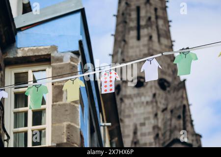 Decoration imitating drying clothes strung across a street in Clermont Ferrand, with the cathedral in the background Stock Photo