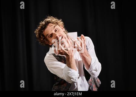 Hands to mouth, man in tie and white shirt. Stock Photo