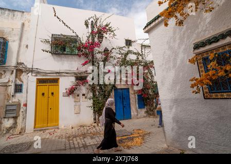 Tunis, Tunisia. 7th May 2024 Traditional blue and yellow doors of typical Tunisian architecture in the colourful alleyways of the Medina in Tunis, cap Stock Photo