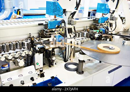 Single sided automatic edge banders on factory Stock Photo
