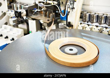 Single sided automatic edge banders on factory Stock Photo