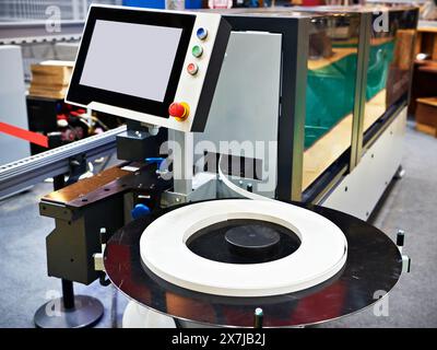 Single sided automatic edge banders on factory Stock Photo
