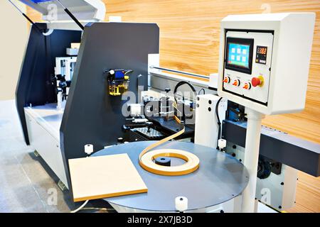 Single sided automatic edge banders on factory Stock Photo