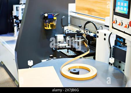 Single sided automatic edge banders on factory Stock Photo