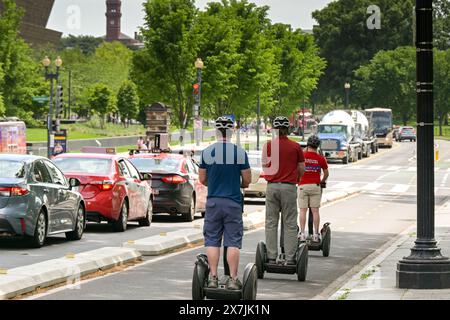 Washington DC, USA - 30 April 2024: Group of people riding on Segway self balancing vehicles on a sightseeing trip around the city Stock Photo