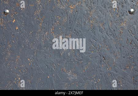 Wooden wall, texture, background. Grey-colored surface and backdrop, made from pressed wood chips. Abstract picture with chaotic pattern Stock Photo