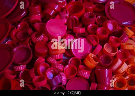 Goiania, Goias, Brazil – April 29, 2024: A pile of red plastic caps separated for recycling. Stock Photo