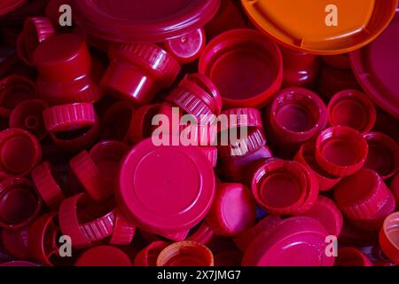 Goiania, Goias, Brazil – April 29, 2024: A pile of red plastic caps separated for recycling. Stock Photo