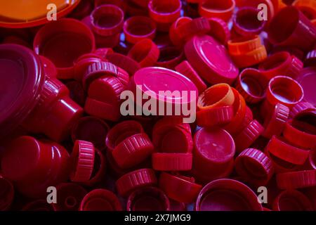Goiania, Goias, Brazil – April 29, 2024: A pile of red plastic caps separated for recycling. Stock Photo