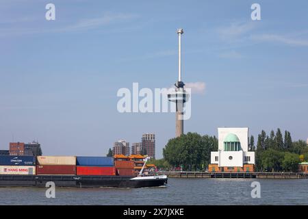 Ship loaded with containers passing landmarkt the 'Euromast' at the port of Rotterdam, Netherlands Stock Photo