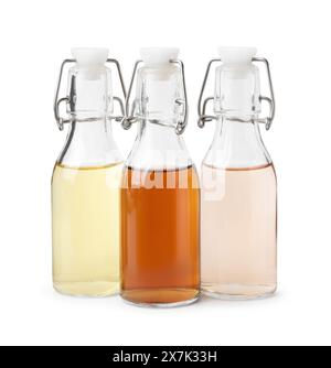 Different types of vinegar in bottles isolated on white Stock Photo