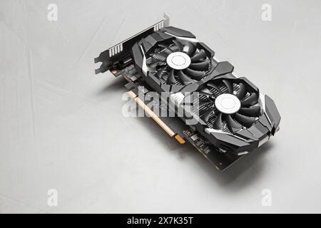 Computer graphics card on gray textured background, space for text Stock Photo