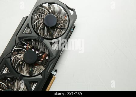 Computer graphics card on gray textured background, top view. Space for text Stock Photo