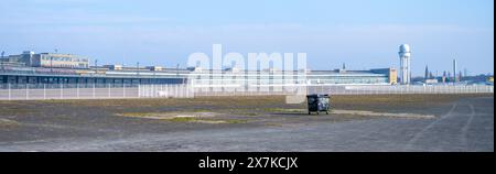 View of the historic Berlin Tempelhof Airport main building with open space and clear skies. Berlin, Germany Stock Photo