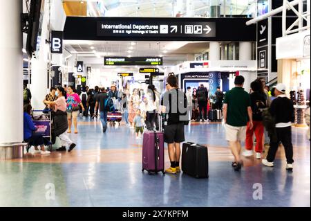 Auckland, New Zealand - February 21, 2024: Travelers inside at the Auckland International Airport. Stock Photo