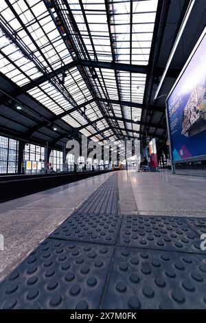 Railway station with glass roof, modern lighting and tracks, Berlin, Germany Stock Photo