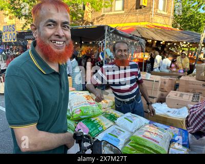 Two men with henna colored beards and hair at Bangladeshi street fair in the Kensingto section of Brooklyn, New York Stock Photo