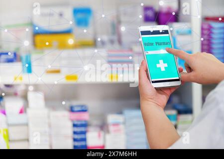 Pharmacist using mobile smart phone for search bar on display in pharmacy drugstore shelves background.Online medical concept. Stock Photo