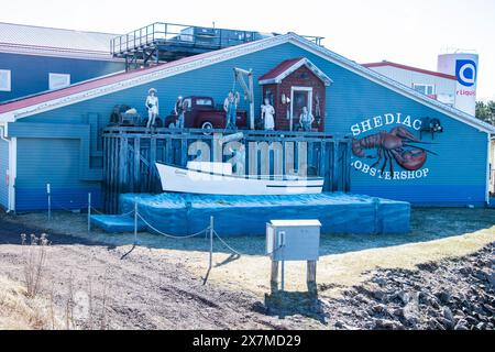 Mural of people, boat and vintage red truck at the Shediac Lobster Shop in New Brunswick, Canada Stock Photo