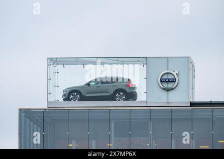 Gothenburg, Sweden - March 01 2024: Volvo XC40 car on display on the roof of a car dealership Stock Photo