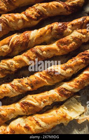 Homemade Cheese Straws on greaseproof paper Stock Photo