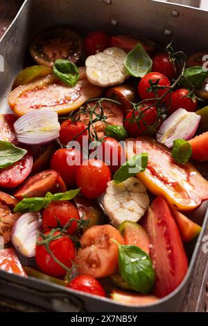Seasoned fresh tomatoes, garlic, shallot, basil Stock Photo