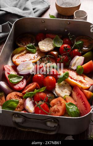 Seasoned fresh tomatoes, garlic, shallot, basil Stock Photo