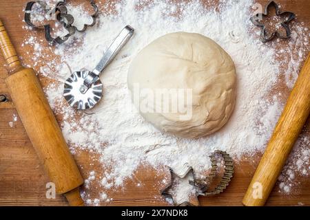 dough on the table with dough tools. forms for squeezing the dough Stock Photo