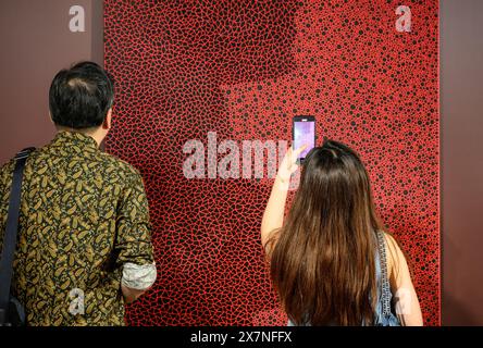 Hong Kong. May 21, 2024, Hong Kong, Hong Kong Sar, China: Kusama rare work for Auction at Bonhams in Bonhams Auctioneers Pacific Place Admiralty, Hong Kong.'Infinity', painted in 1995, combines Kusama's Two Signature Motifs ''“ Dots and Infinity Nets - in One Single Canvas, the Only Example Ever to Appear at Auction.One-of-a-kind composition in two vertical halves has never been seen before at auction and is expected to fetch in the range of HK$40 Million or Â£4million. Credit: ZUMA Press, Inc./Alamy Live News Stock Photo