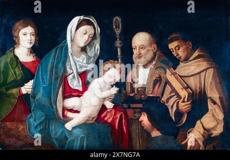 Vincenzo Catena, Virgin and Child with Saints and a Donor, painting in oil on panel, 1500-1505 Stock Photo