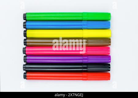 colored pens on a white background. place for text. top view Stock Photo
